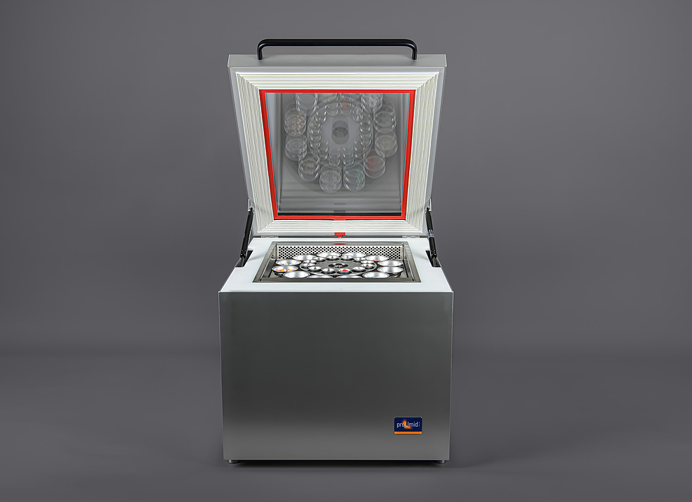 Front view of an opened SPS device against a grey background.