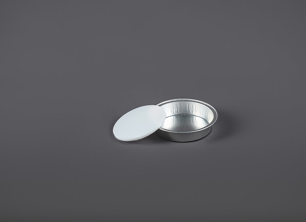 PTFE-Einlegeschalen auf grauem Hintergrund
